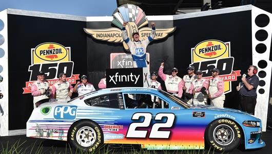 Austin Cindric celebrates with his Team Penske teammates on Victory Podium after winning the Pennzoil 150 at the Brickyard on Saturday, Aug. 14.