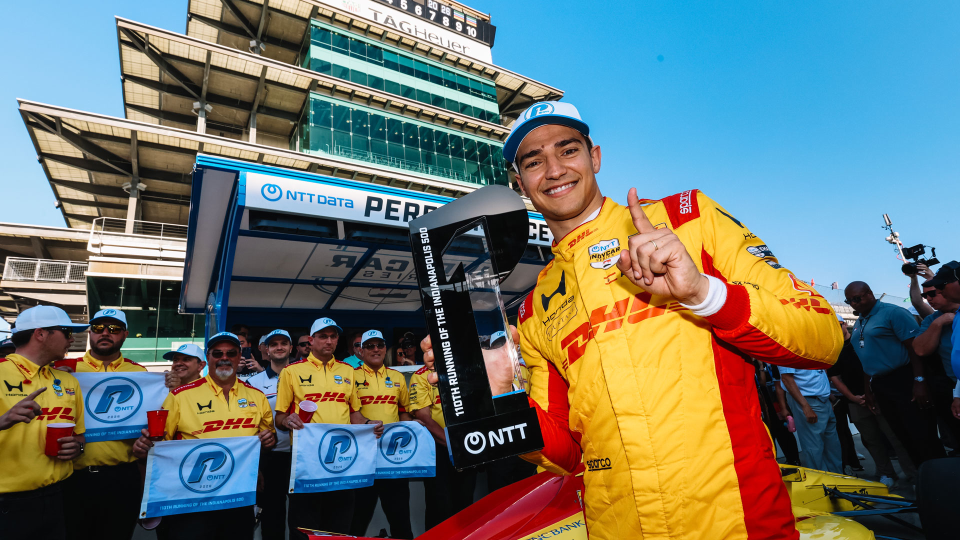 Alex Palou celebrates the NTT P1 Award for the 2026 Indianapolis 500 presented by Gainbridge