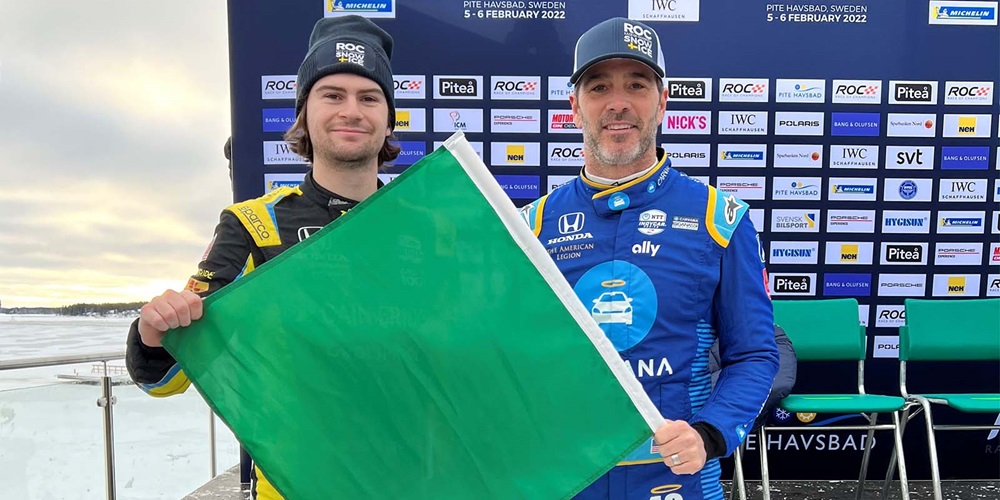 Colton Herta and Jimmie Johnson with Indy 500 Green Flag