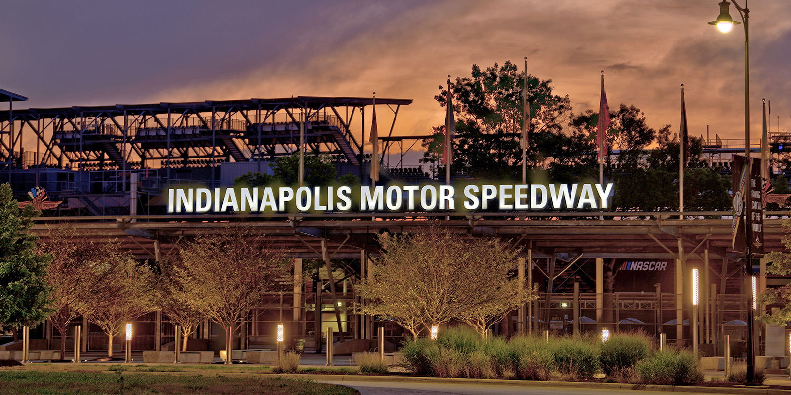 An image of the Indianapolis Motor Speedway's famed Gate 1 at sunrise