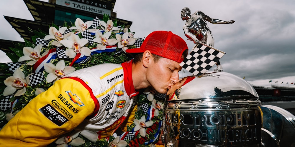 Josef Newgarden Kisses the BorgWarner Trophy