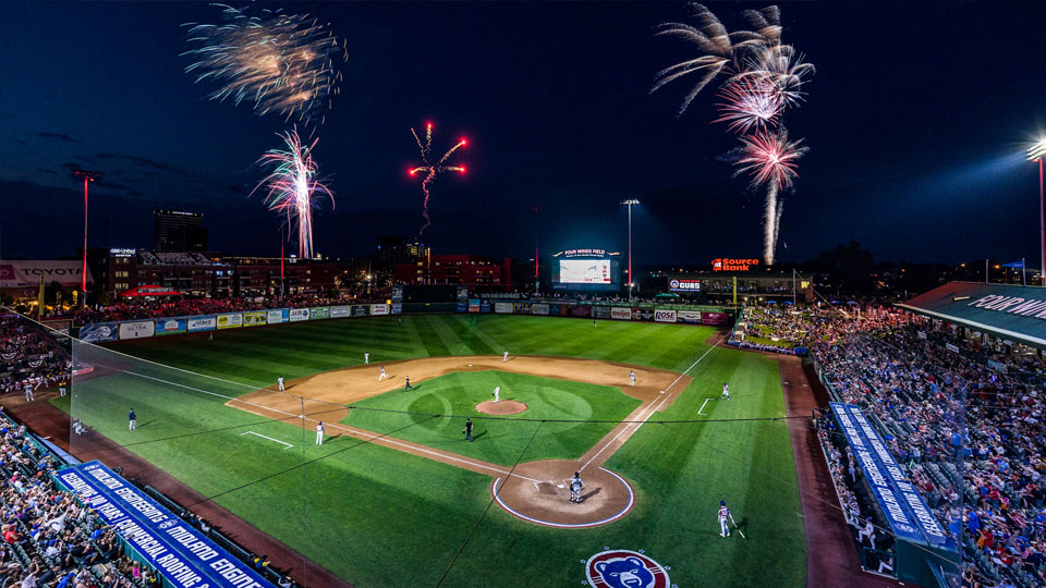 Fireworks in the night sky over a South Bend Cubs baseball game