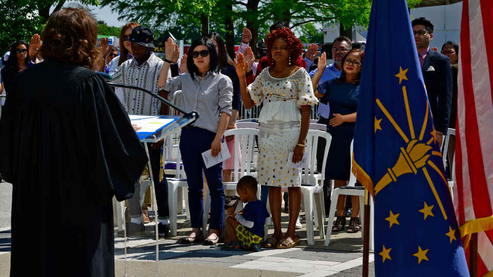 People performing the Naturalization Ceremony at IMS