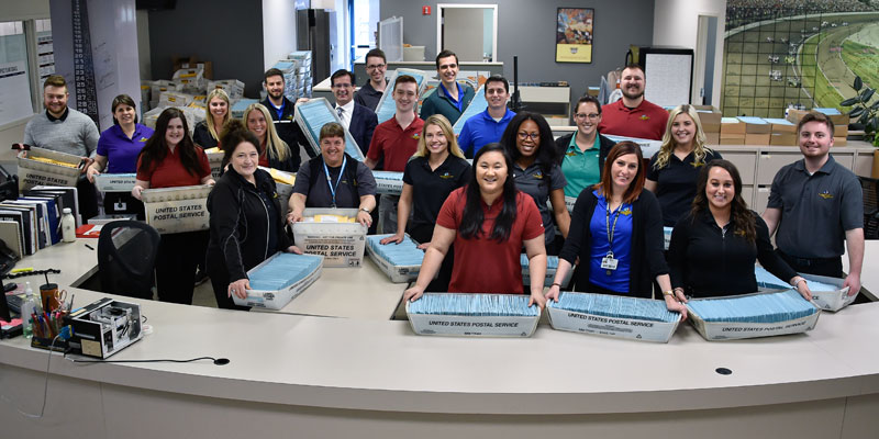 Employees help customers in the Indianapolis Motor Speedway ticket office