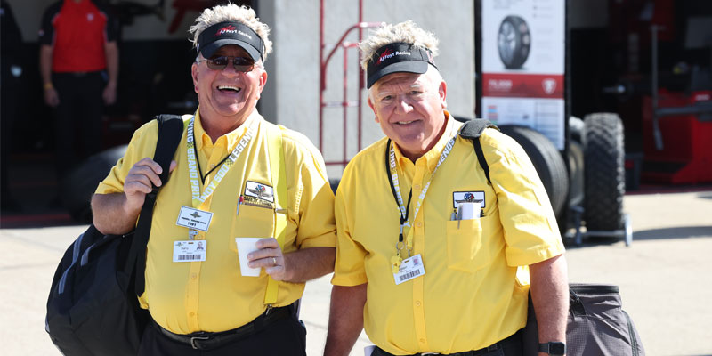 Safety patrol members walk through the garage area
