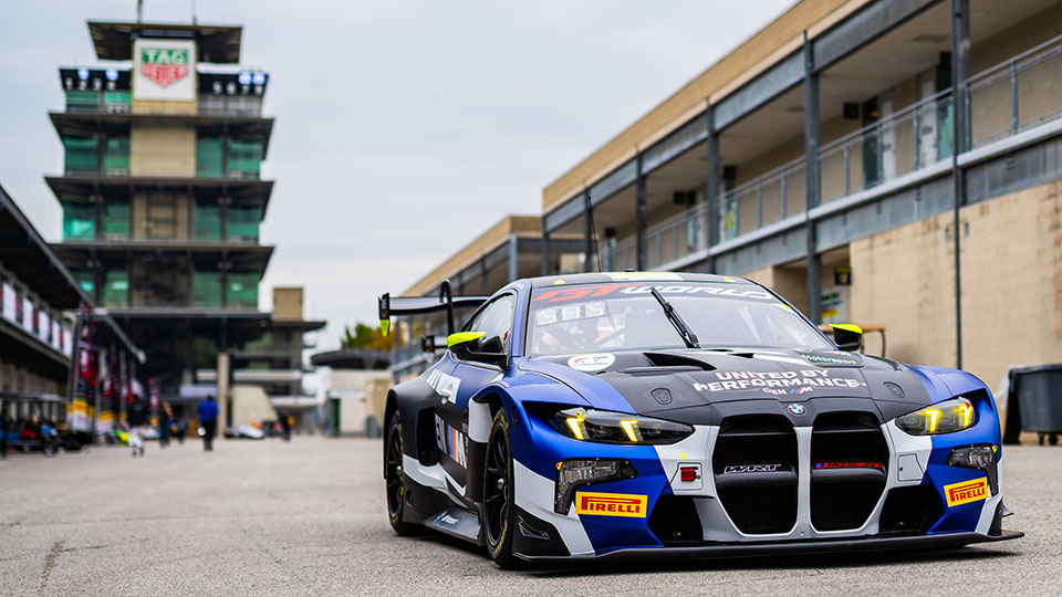 A car sits in front of the pagoda