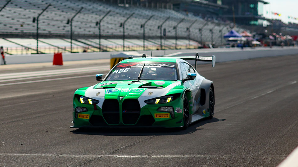 A car races at the Indianapolis 8 Hour