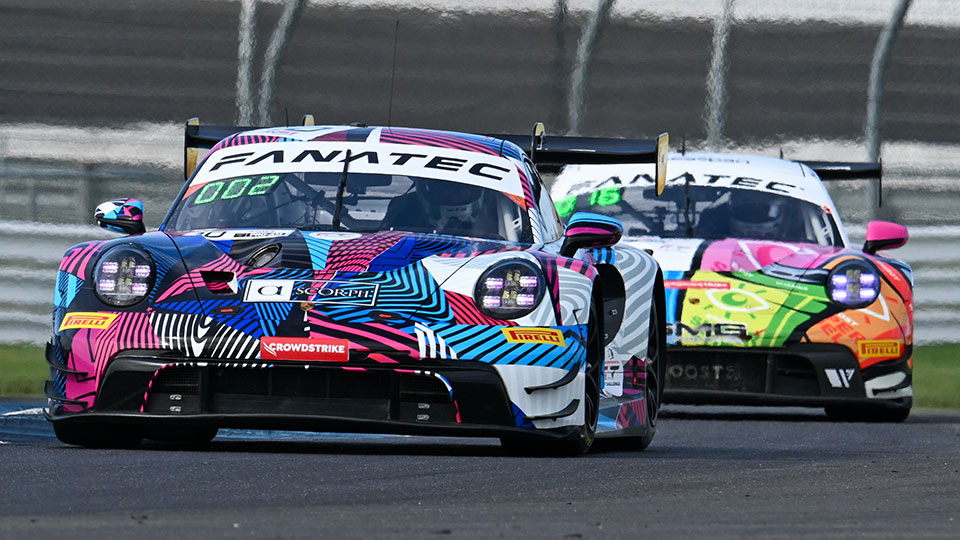 A car races at the Indianapolis 8 Hour.