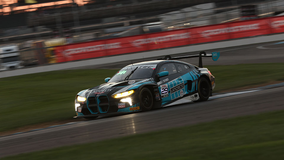 A car races at the Indianapolis 8 Hour