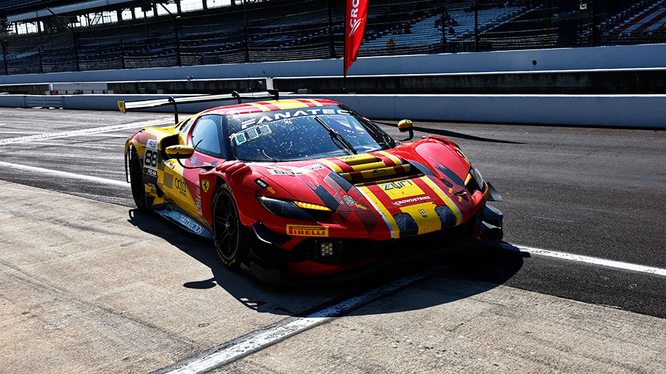 A car races at the Indianapolis 8 Hour