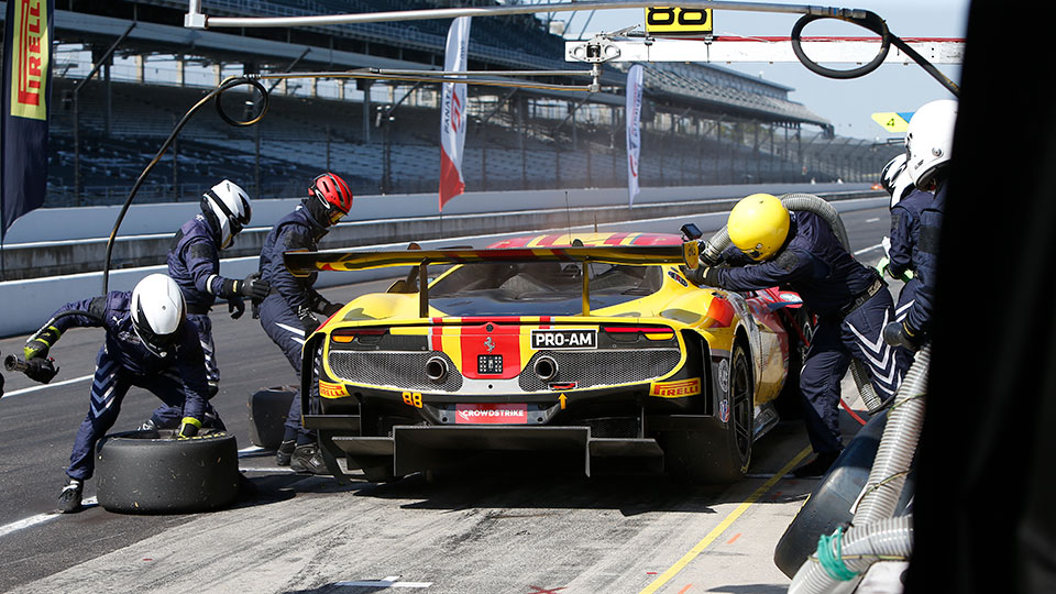 A car makes a pit stop at the Indianapolis 8 hour