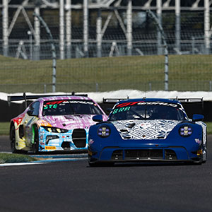 A car races in the Indianapolis 8 Hour