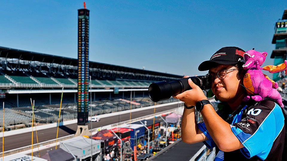 A fan takes photos at IMS