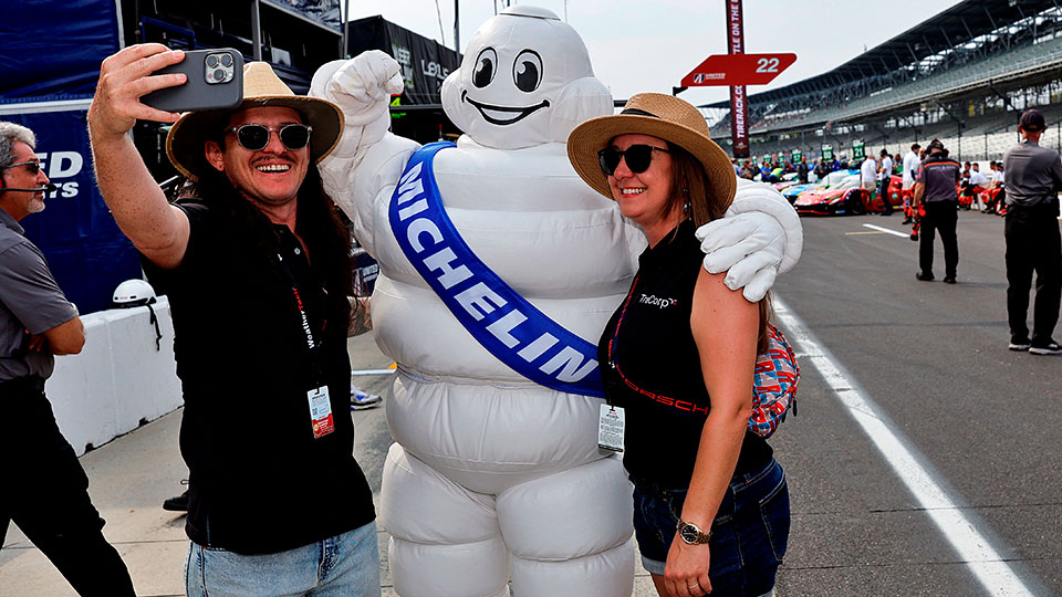 Fans pose with the Michelin man