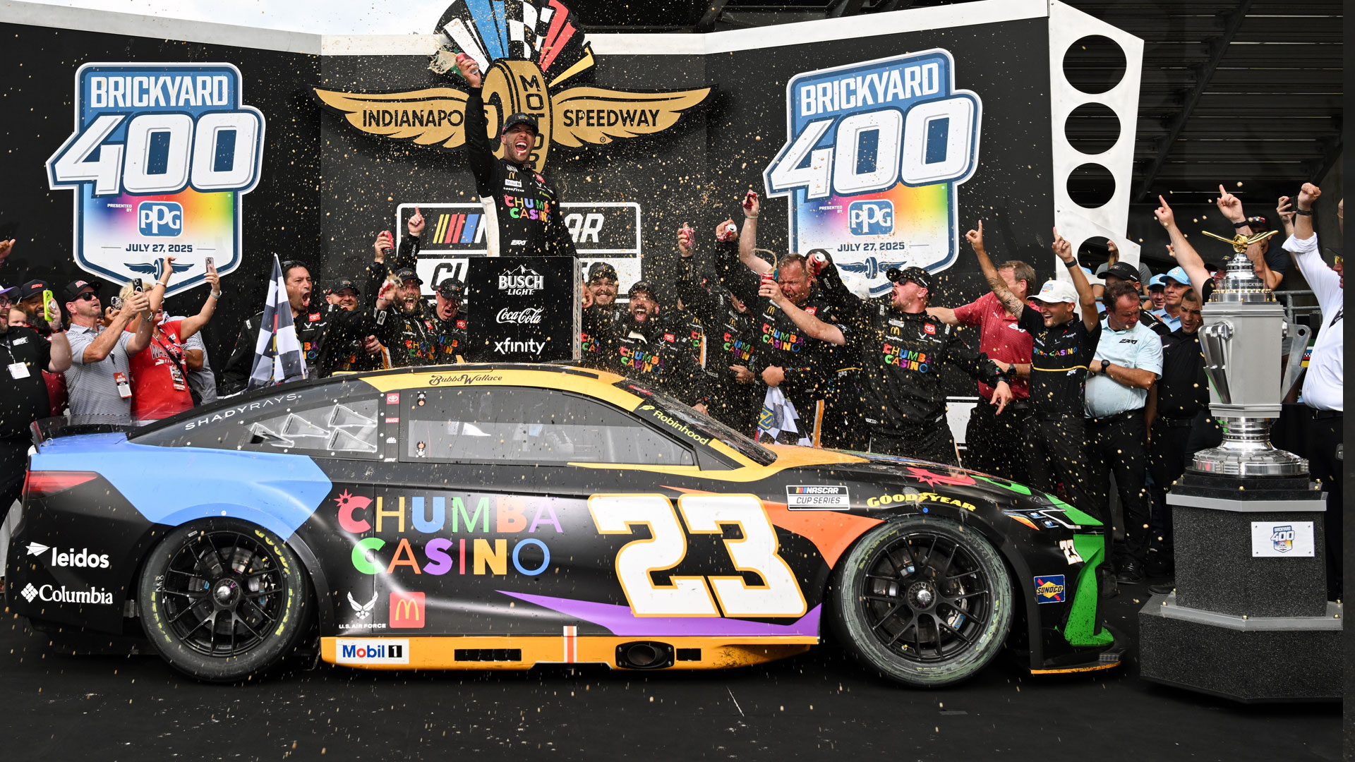 Bubba Wallace celebrates victory in the 2025 Brickyard 400 presented by PPG