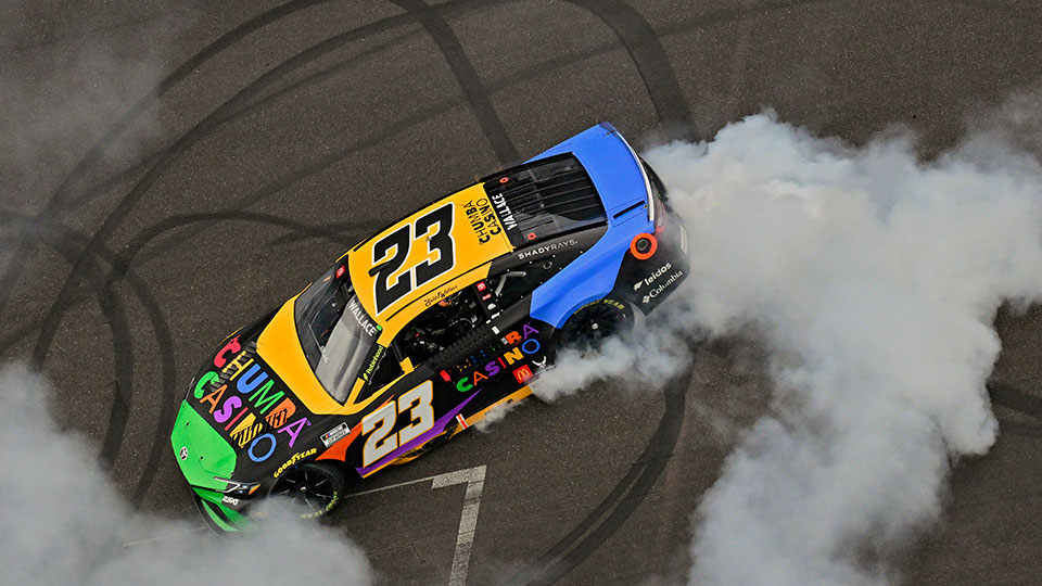 Bubba Wallace celebrates his Brickyard 400 win