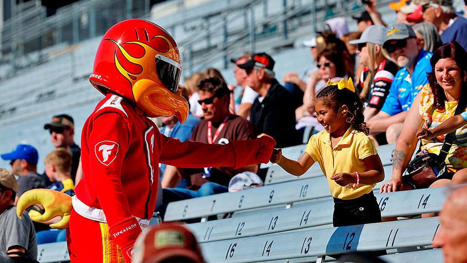 A child fistbumps Firehawk