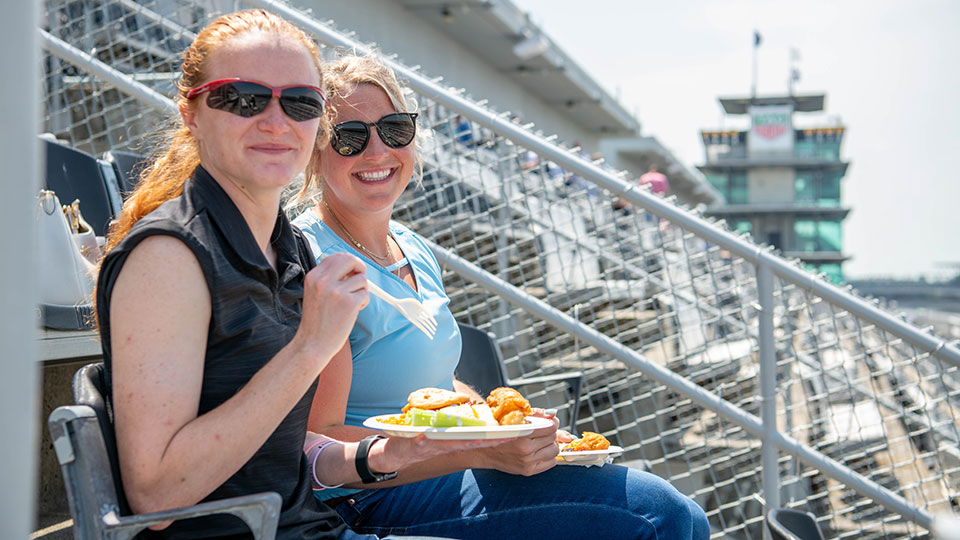Women enjoy eating in a suite