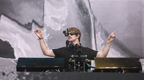 A DJ performs in the Snake Pit