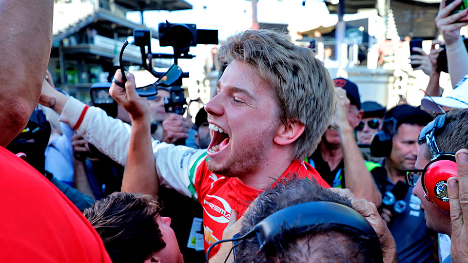 Robert Schwartzman celebrates winning the pole