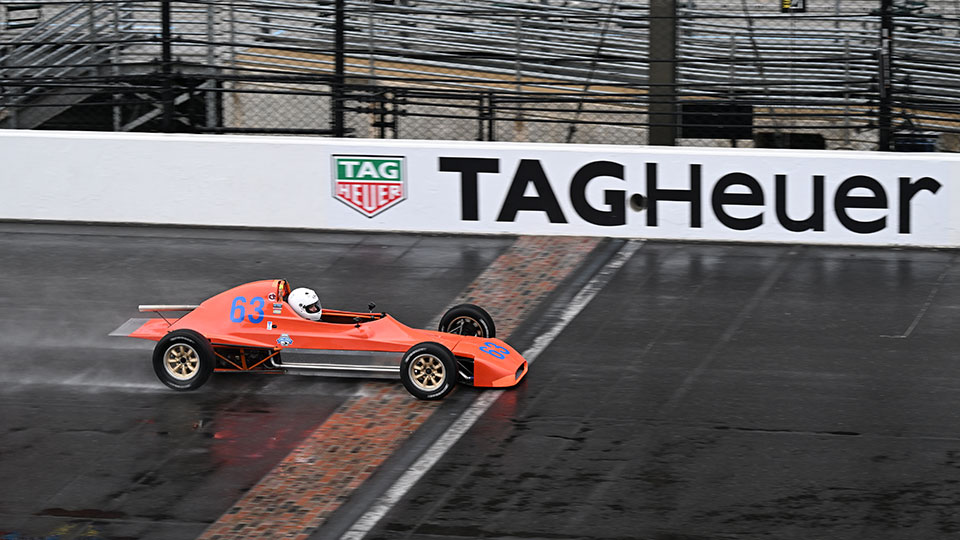 A racer races at IMS