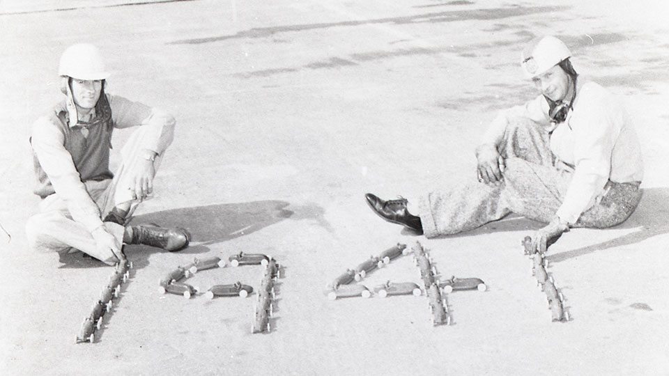 Ralph Hepburn and Sam Hanks pose on the track
