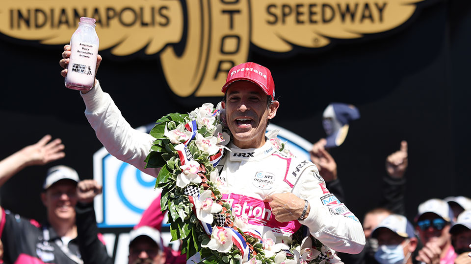 Helio Castroneves celebrates his fourth Indy 500 win