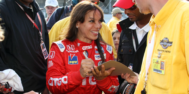 Milka Duno signs autographs on pit road in 2009