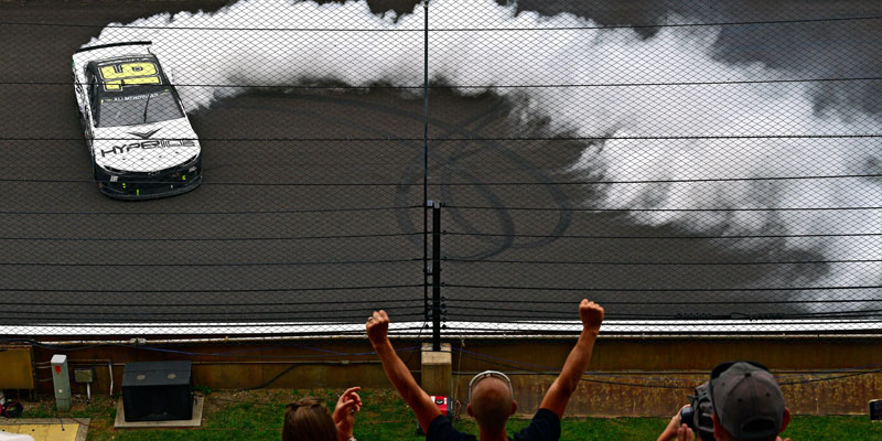 A. J. Allmendinger celebrates victory with a burnout after the 2021 Verizon 200