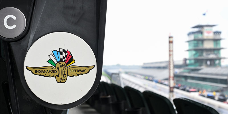 An image zoomed in on a penthouse seat at IMS with the scoring pylon and Pagoda in the background