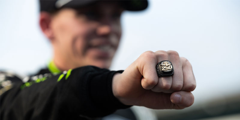 Riley Herbst shows off his champion's ring after winning the Pennzoil 250