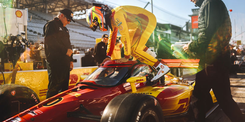 Alex Palou climbs in his car for Practice 1