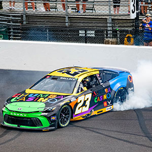 Bubba Wallace celebrates winning the Brickyard 400