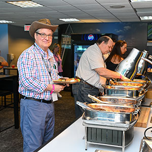 A man enjoys the food of the Gallagher Club