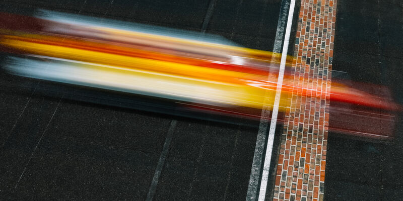 An INDYCAR crosses the yard of bricks