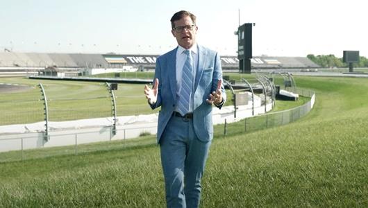 Doug Boles Stands on a grass-covered mound in the infield of Indianapolis Motor Speedway